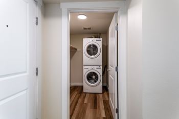 Stacked washer and dryer in closet laundry space